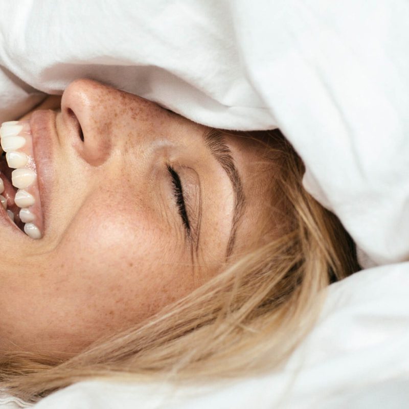 Bild einer strahlenden Patientin